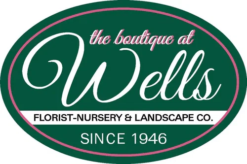 The Boutique at Wells Florist Merchant Logo